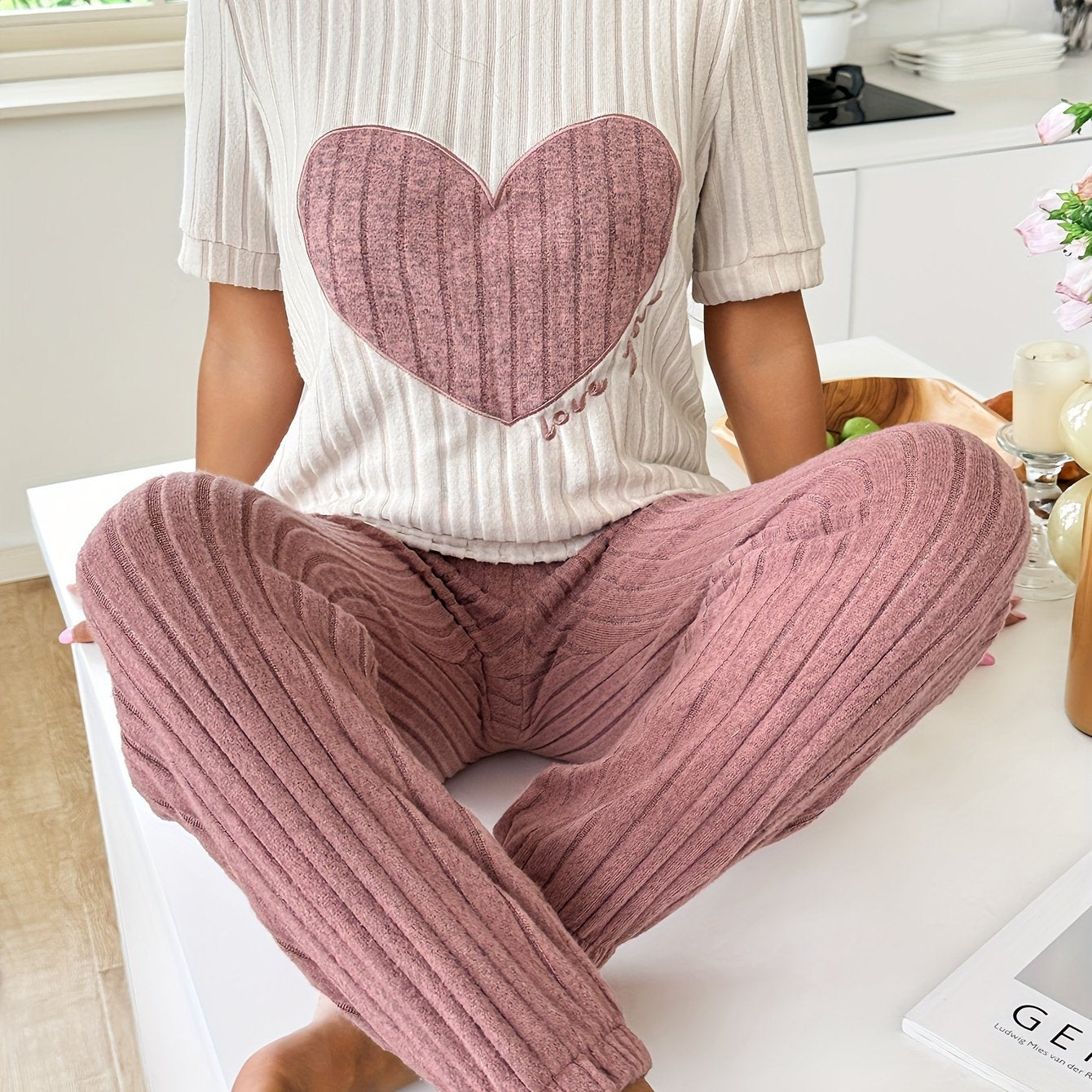 Women's heart and letter print pajama set with short sleeve top and joggers, relaxed fit for comfortable summer nightwear.