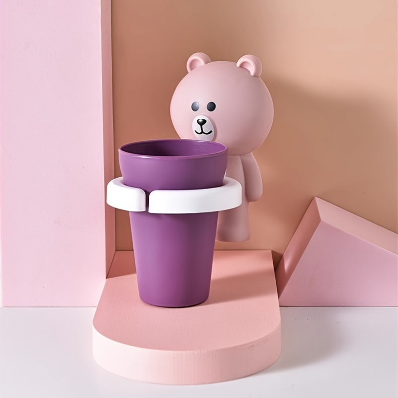 Wall-mounted bear toothbrush holder with cup - no drilling, space-saving bathroom organizer.