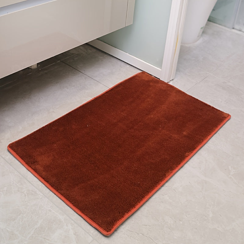 Machine-made oblong bath rug made from quick-dry absorbent knit fabric with non-slip features. Crafted from polyester fiber, this rug is 1.8cm thick and has a weight of 780gsm. Suitable for entryways, bedrooms, living rooms, and garages. Easy to care for