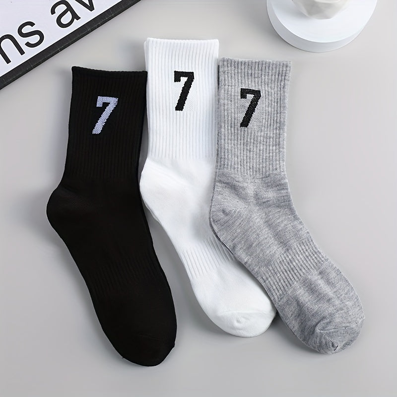 3 pairs of men's mid-calf socks with 17.78cm trendy design in black, white, and gray colors. Made of soft polyester/spandex blend, breathable and sweat-absorbent. Casual athletic wear