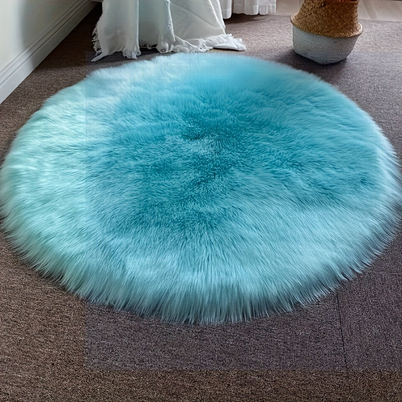 Round luxury area rug made from soft faux fur material with high pile and knit weave, machine washable, lightweight and fluffy. Crafted from a blend of polyester and acrylic in a solid color design. Perfect for adding a cozy touch to bedroom, living