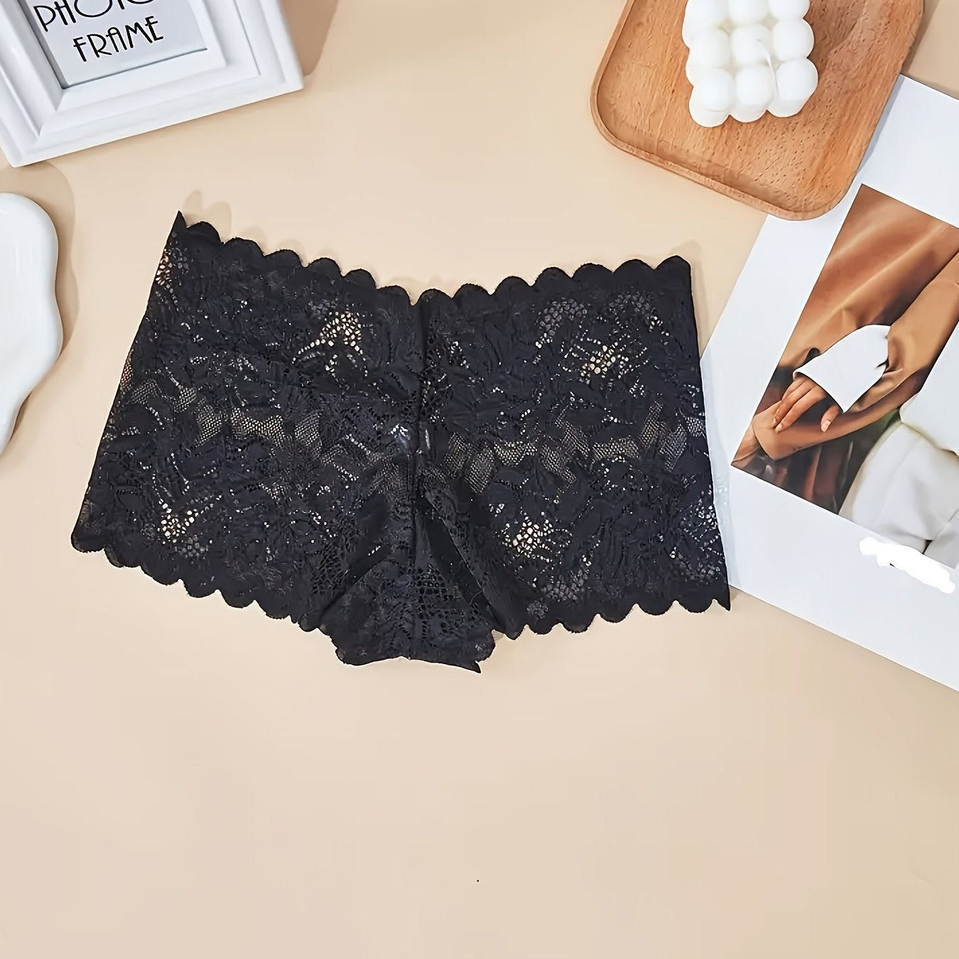 Sexy and comfortable lace boy shorts for women with floral pattern, low-rise, and breathable design. Nylon/elastane blend, hand washable.