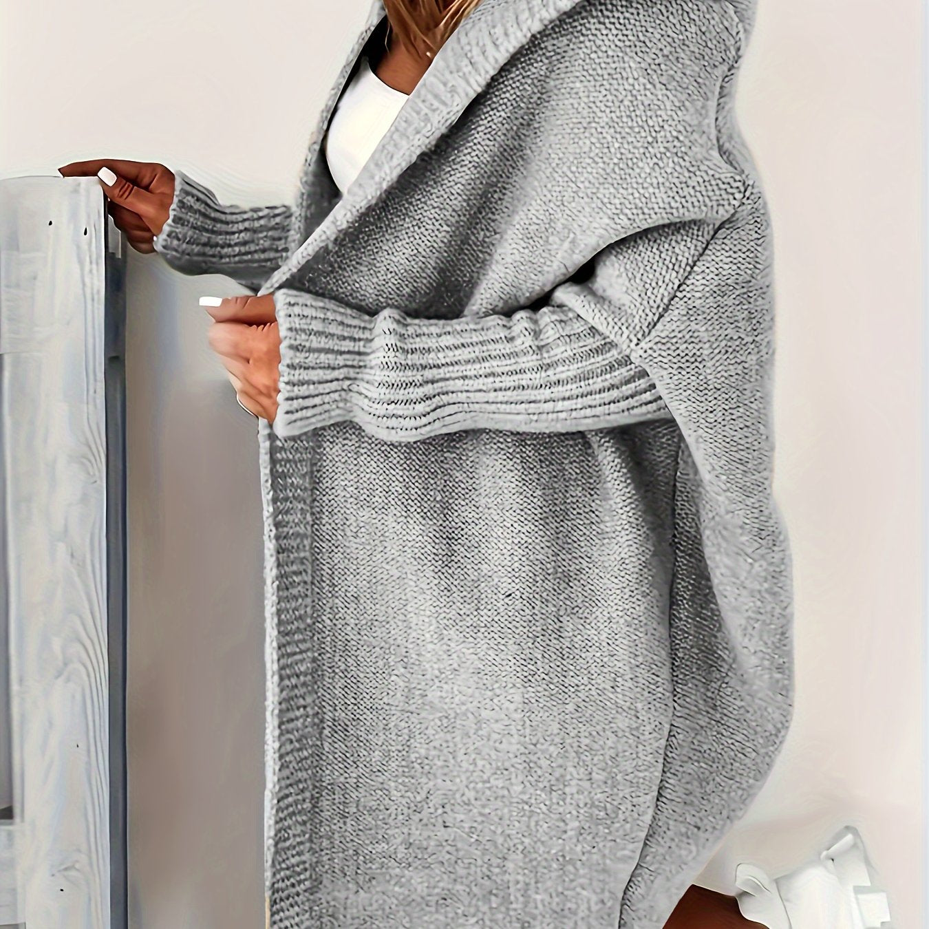 Plus size cozy gray cardigan with batwing sleeves, perfect for spring/fall. Made of easy-care polyester.