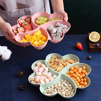 Heart-shaped party snack tray with 4 compartments, perfect for serving nuts, candy, fruit, and other snacks. Made of reusable plastic in blue, green, beige, and pink colors.