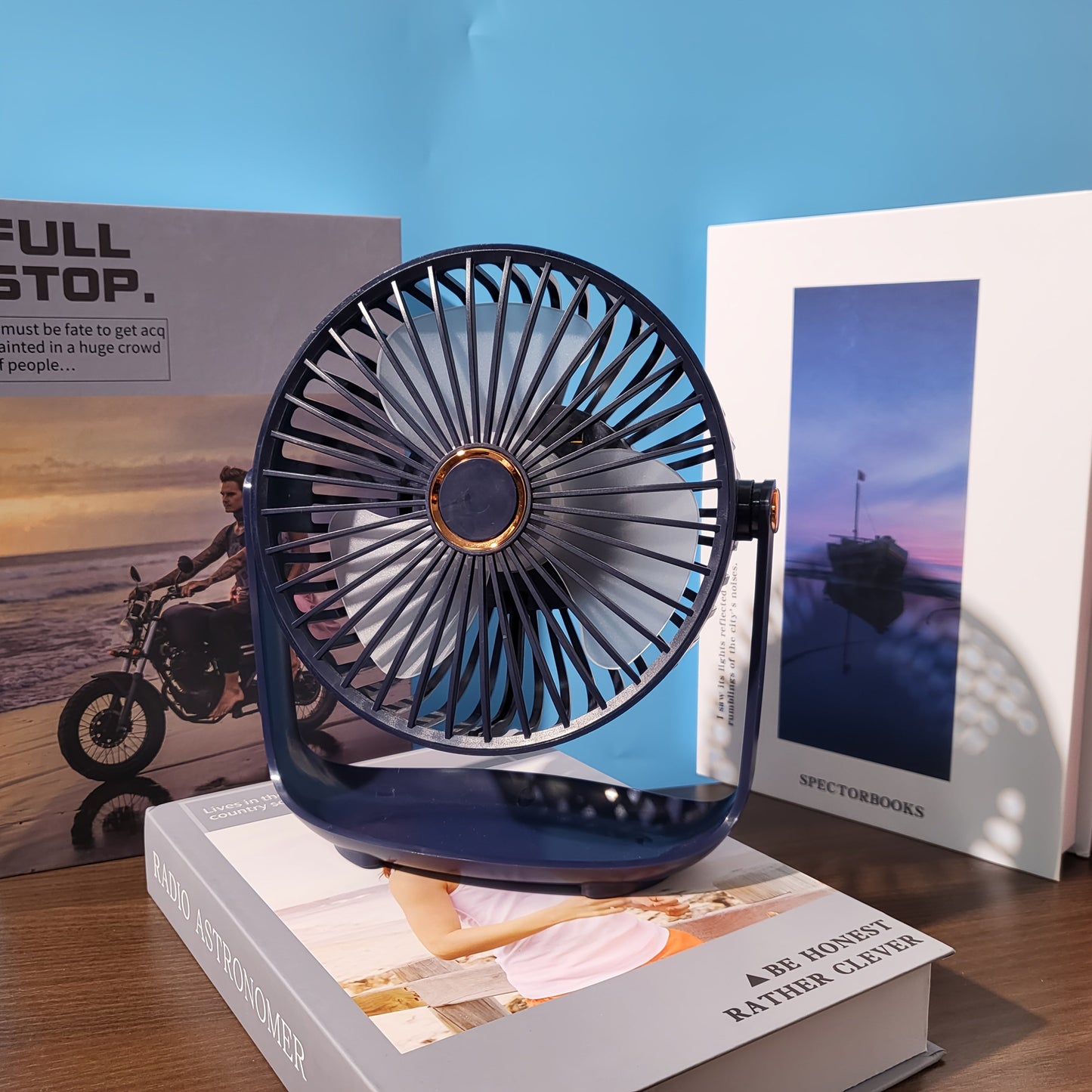 Experience the convenience of the JKUOO 19.99cm Portable Desk Fan with Nightlight. This fan features USB-C charging, 5-speed settings, 360° tilt, quiet operation, a 1200mAh lithium battery, and is made of high-quality plastic material. Perfect for both