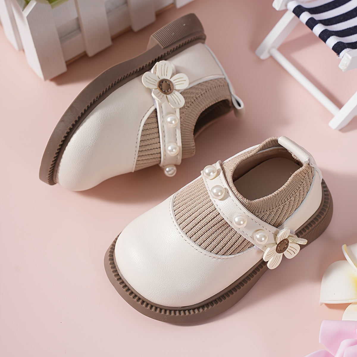 Pair of stylish baby shoes with flower bead accents, perfect for all seasons, including princess flats.