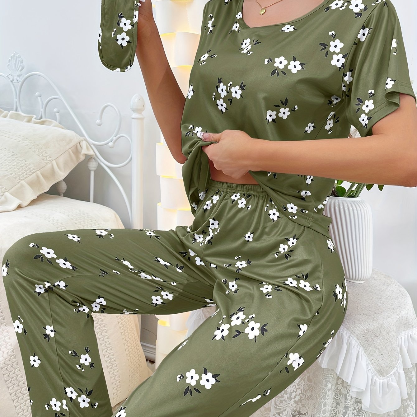 Women's sleepwear set with floral print loose pajamas, short-sleeve tee top, and pants.