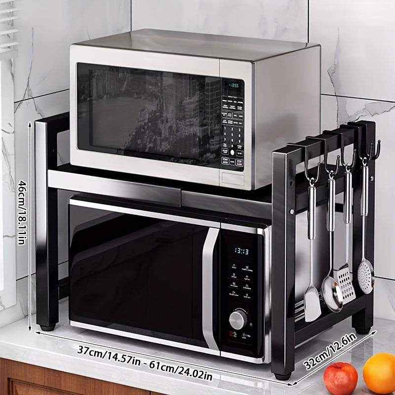 Black expandable microwave rack with 6 hooks for hanging spoons, an extendable stand for kitchen utensils, and storage for rice cookers and toasters. Width ranges from 37cm to 61cm.