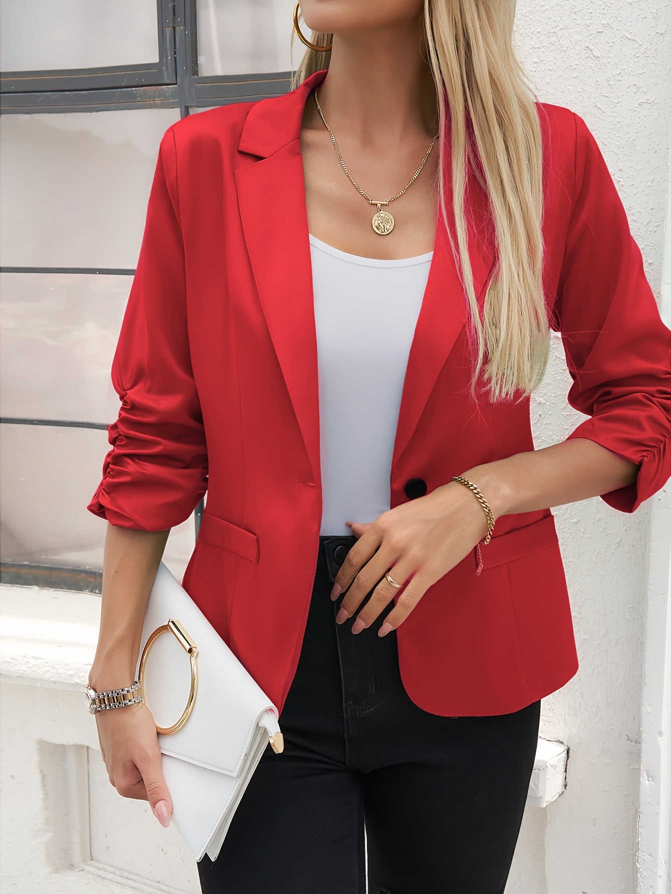 Women's slim-fit casual blazer with a single button placket, roll-up sleeves, and polyester lining for spring/fall season.