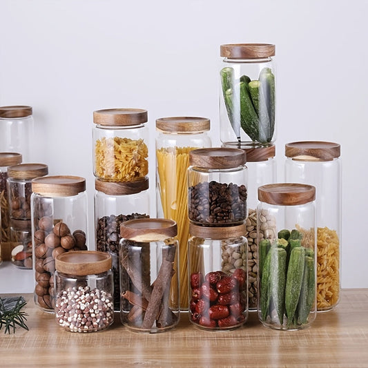 Glass storage jars with bamboo lids, perfect for storing food. These airtight canisters are ideal for holding candy, cookies, rice, coffee beans, snacks, spices, and other kitchen essentials.