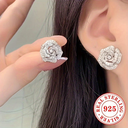 These stunning stud earrings are crafted from 4.4g of 925 sterling silver and feature synthetic zirconia stones. The elegant rose flower design exudes luxury and sophistication, making them a perfect accessory for daily wear or special occasions like