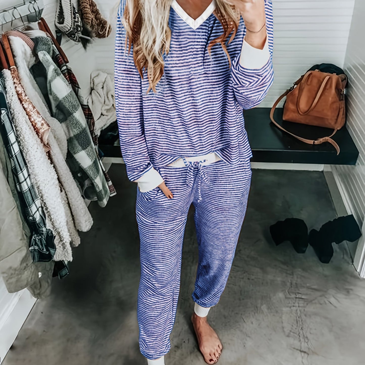 Casual knit pajama set with V-neck, striped design, and drawstring. Made of 95% polyester and 5% elastane for fall/winter home wear. Includes long sleeve top and matching lounge pants.