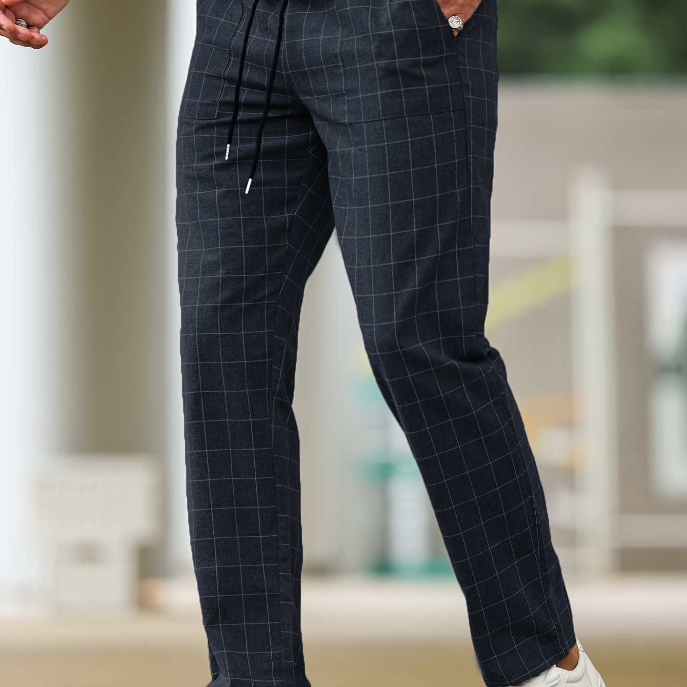 Men's polyester pants with drawstring waist, ideal for spring and fall, featuring casual striped plaid pattern.