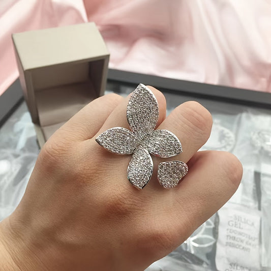 A stylish and sophisticated unisex online celebrity accessory featuring a full zirconia three-dimensional four-leaf flower floral leaf ring.