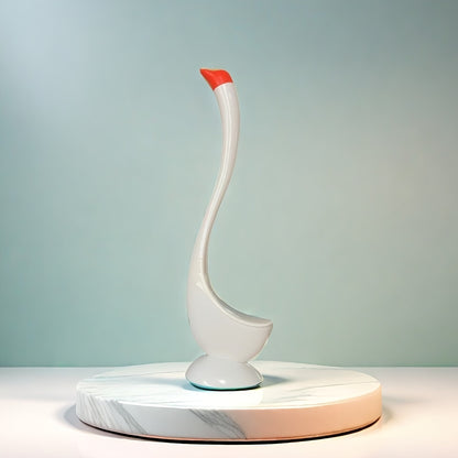 Swan-shaped toilet brush with angled bristles, floor mount, no-drill installation, long handle, medium firmness, kickstand, no electricity required.