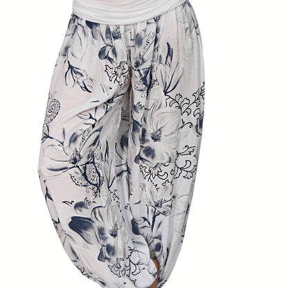 Women's floral print harem pants in blue and white, made of lightweight polyester with wide legs for a casual vacation style. Features a relaxed fit, perfect for machine washing.