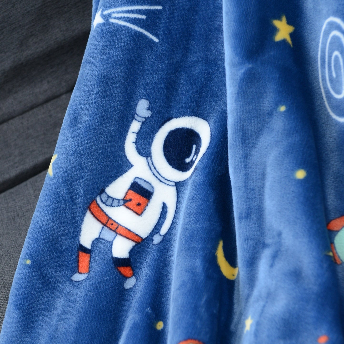 Warm and soft Cozy Astronaut Flannel Throw Blanket with Space Theme - Reversible for couch, bed, office, and travel. Perfect for galaxy lovers, nap time, and adding a touch of mission and wavering style to any space.