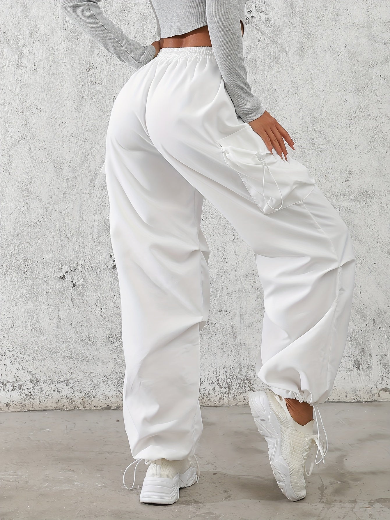 Casual flap pocket cargo pants in solid color for women.