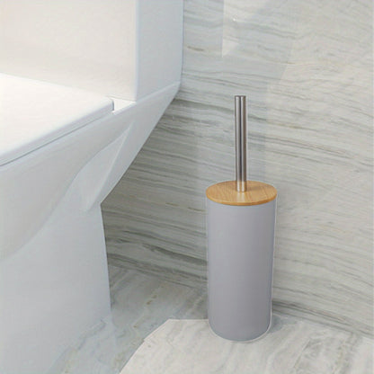 Sturdy plastic toilet brush with holder, medium firmness, portable freestanding bathroom cleaner.