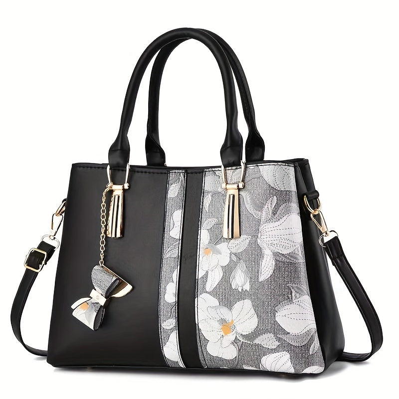 Chic floral print handbag with a spacious crossbody design.