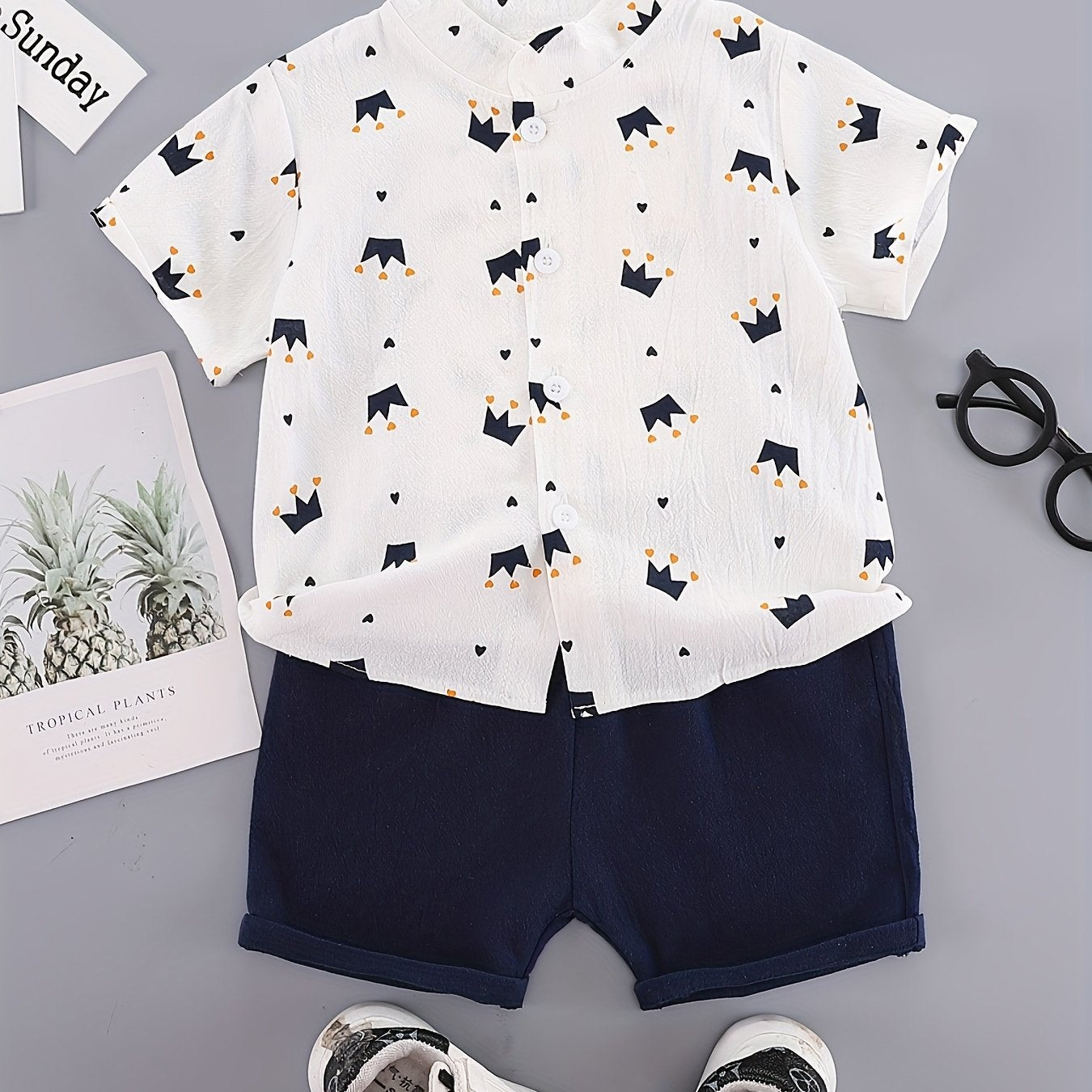 Boys' casual cotton short sets with button front stand collar shirt and shorts in geometric crown print. Made of non-stretch woven cotton-polyester blend for outdoor summer use.