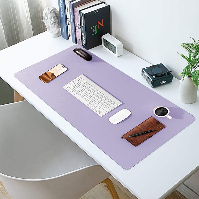 Waterproof faux leather desk pad with anti-slip surface for office and home use. Measures 59.99 x 32.99 cm. Rectangular mouse pad for workspace protection. Sleek and easy to clean design.