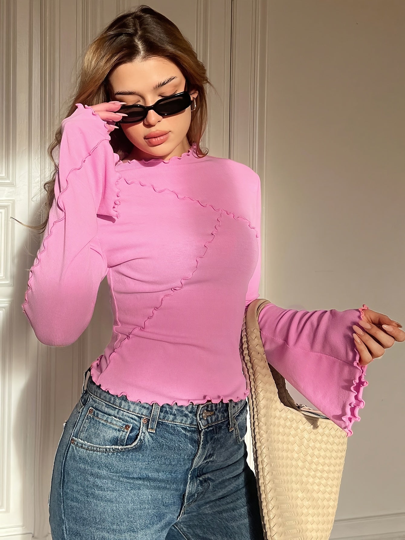 Women's fashion long sleeve crew neck t-shirt with scalloped hem in solid color, made of 95% polyester and 5% elastane knit fabric, suitable for all seasons.