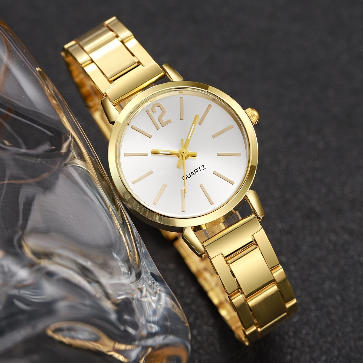 Elegant women's quartz watch and bracelet set with non-rechargeable battery, featuring a round alloy case and fashionable minimalist design. Stylish ladies' accessory (box not included).