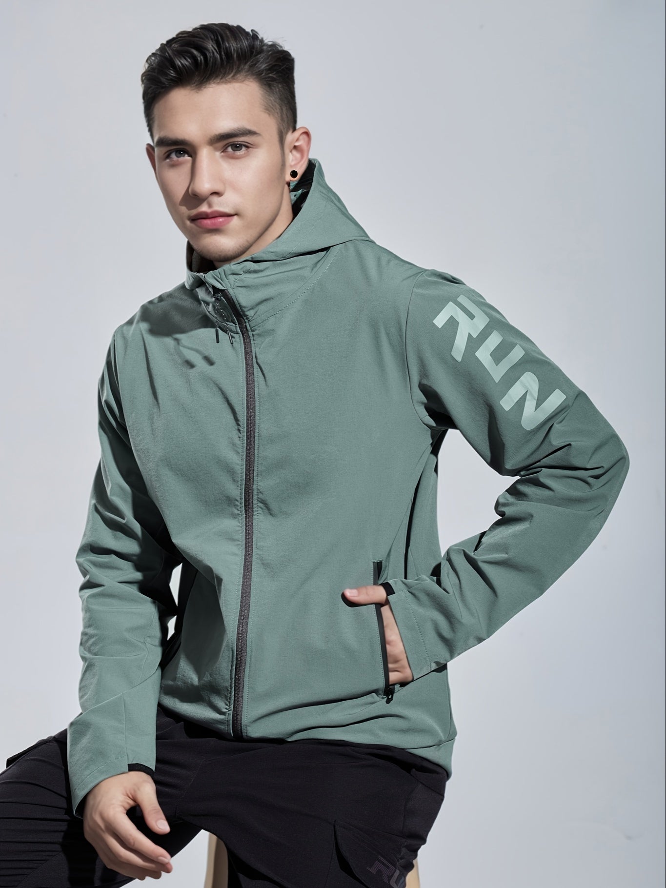 Men's hooded jacket made of 90% polyamide and 10% spandex with alphabet pattern. Features zipper closure and is suitable for hiking, running, and outdoor activities in spring, fall, and