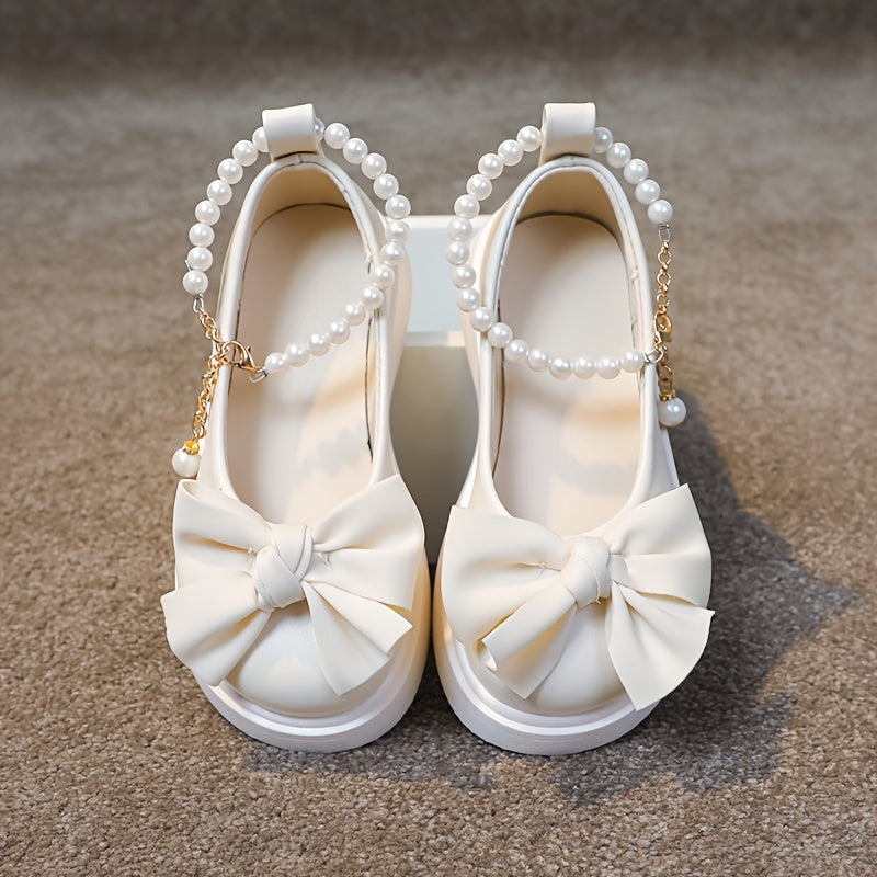 Stylish Mary Jane flats for girls feature pearl and bow accents, perfect for parties and casual wear in spring and fall.