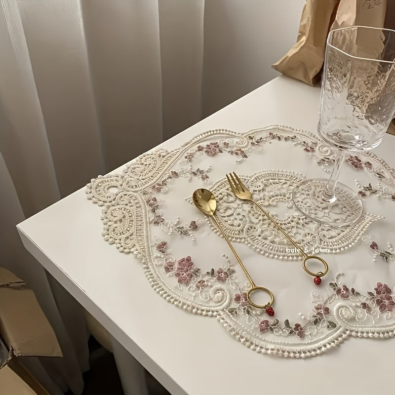 Vintage French lace embroidered placemat in polyester, ideal for dressing up tables or as a photography prop.