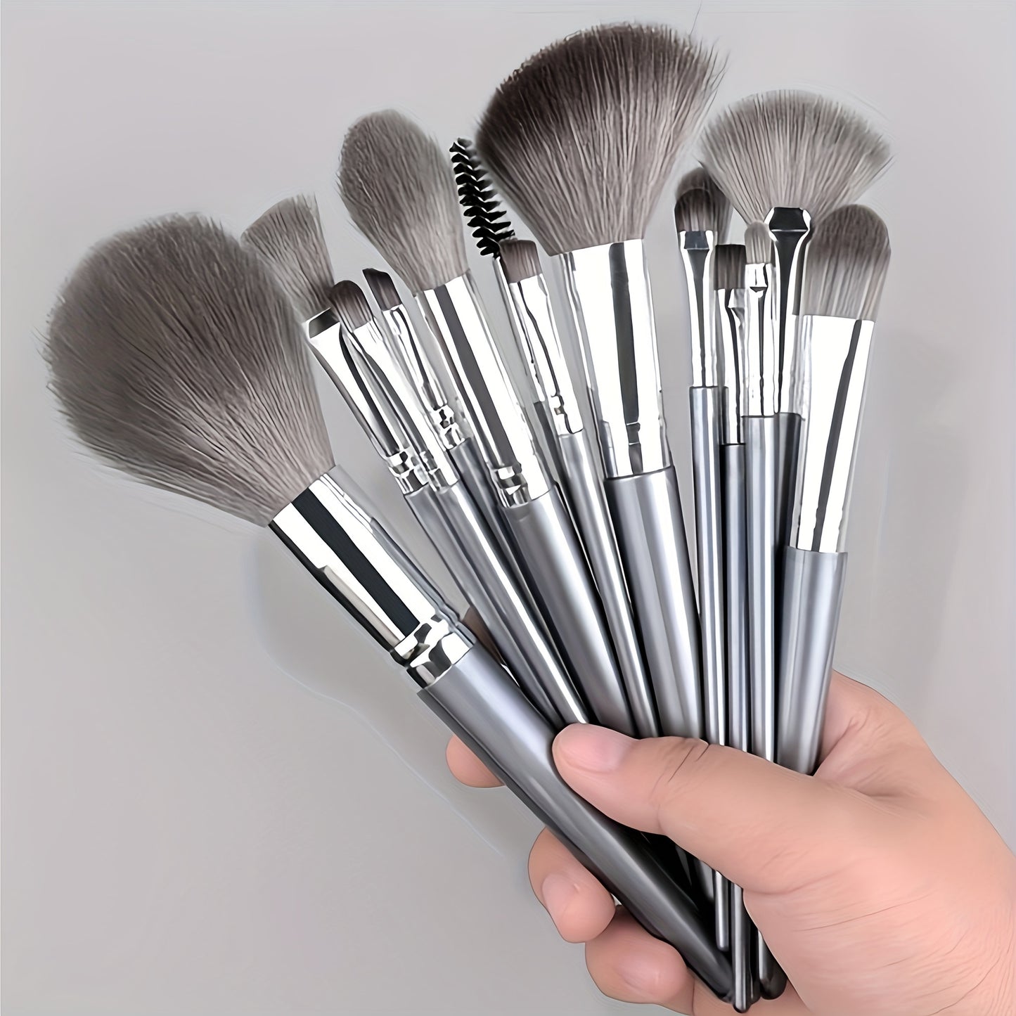 14-piece professional makeup brush set with soft and fluffy silvery/green synthetic hair, ideal for foundation, eyeshadow, eyebrow, and eyeliner application.