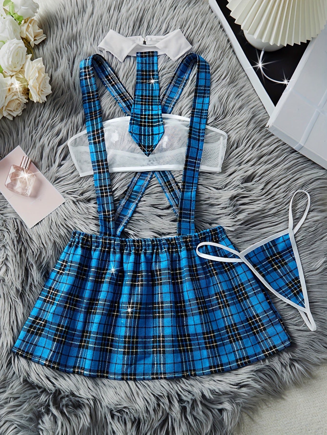 Color block plaid role-playing costume set includes strapless bra, suspender skirt, thong, and tie. Perfect for women's exotic clothing and sexy lingerie.