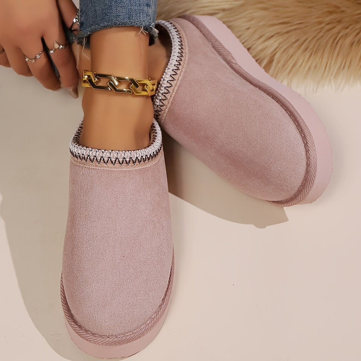 Warm and cozy women's winter slippers with plush lining and anti-slip sole.