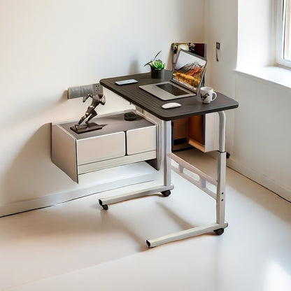 Rolling desk with adjustable height, space-saving metal frame. Ideal for home office and bedroom use. Available in ginger, white, black.