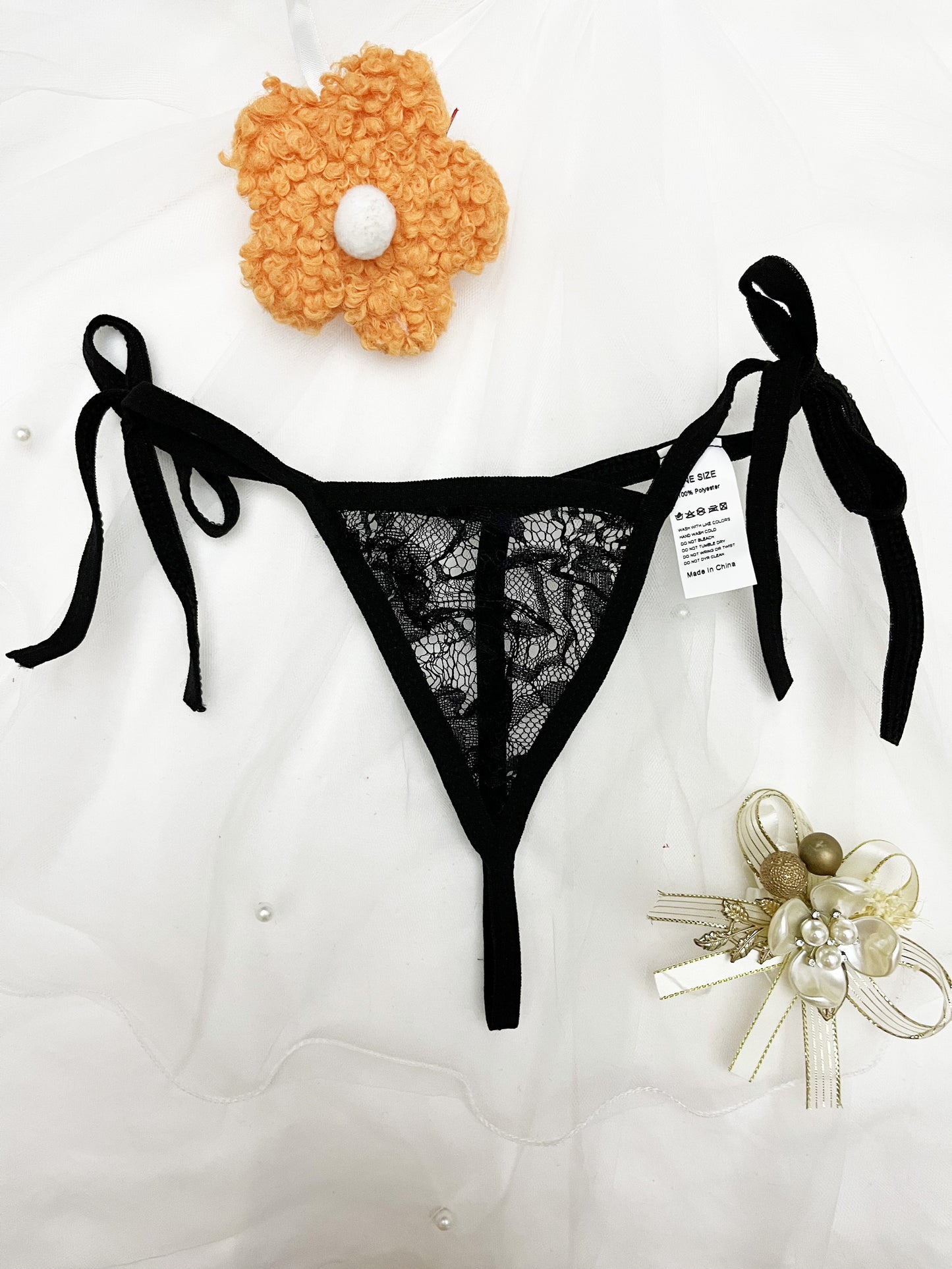 Women's black thong panties set with adjustable straps, made of polyester knit fabric. Pack of 2.