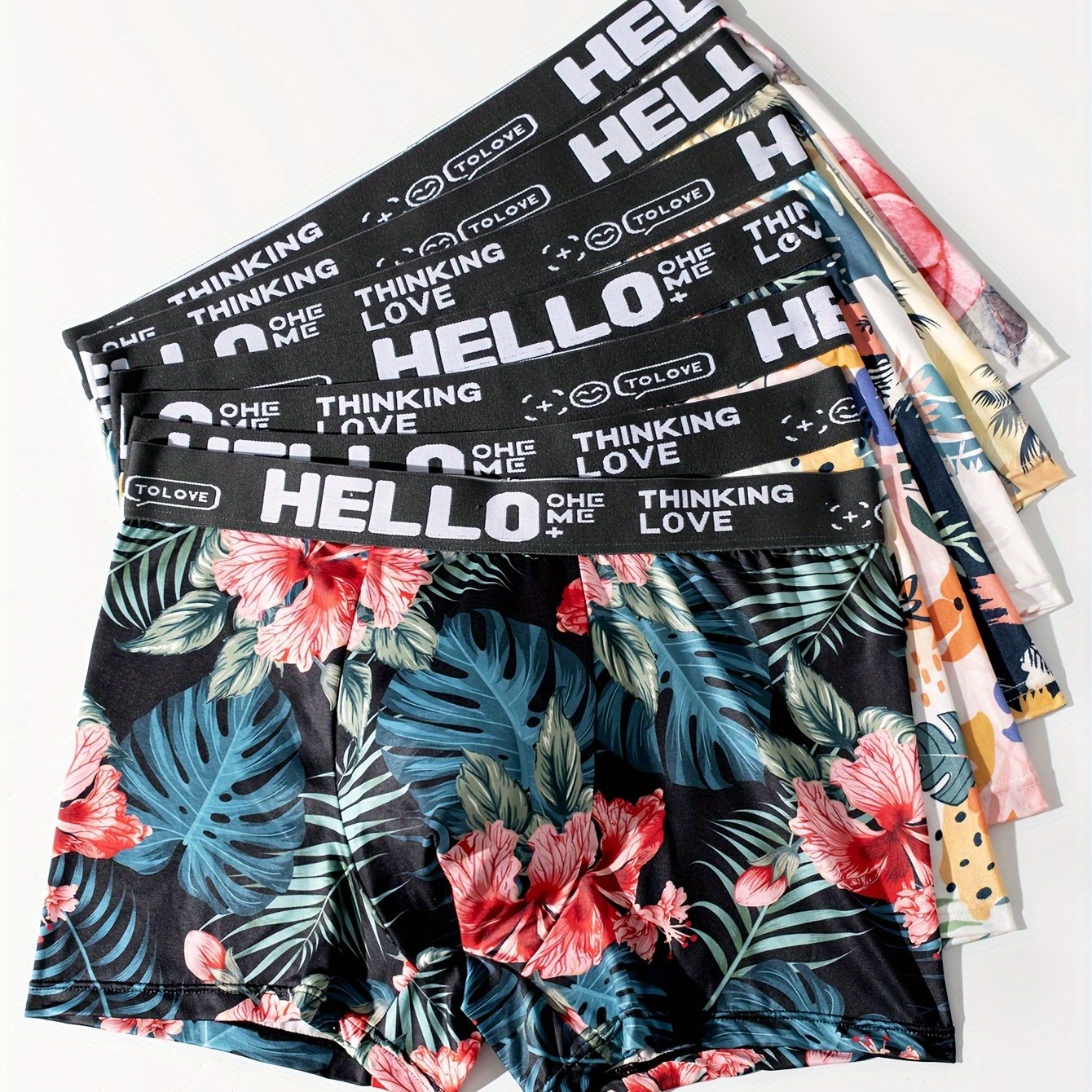 7-pack of men's boxer briefs with soft and stretchy fabric, featuring trendy floral prints and a comfortable, breathable fit.