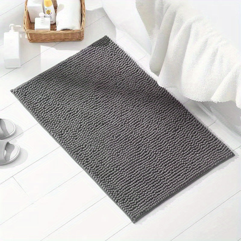 Get this luxurious Chenille Bath Mat, 2cm Thick, with a non-slip, super absorbent, quick-dry design. Made of woven polyester with rubber backing, this mat weighs 1450gsm and is perfect for the bathroom, kitchen, bedroom, or entryway. It also makes a