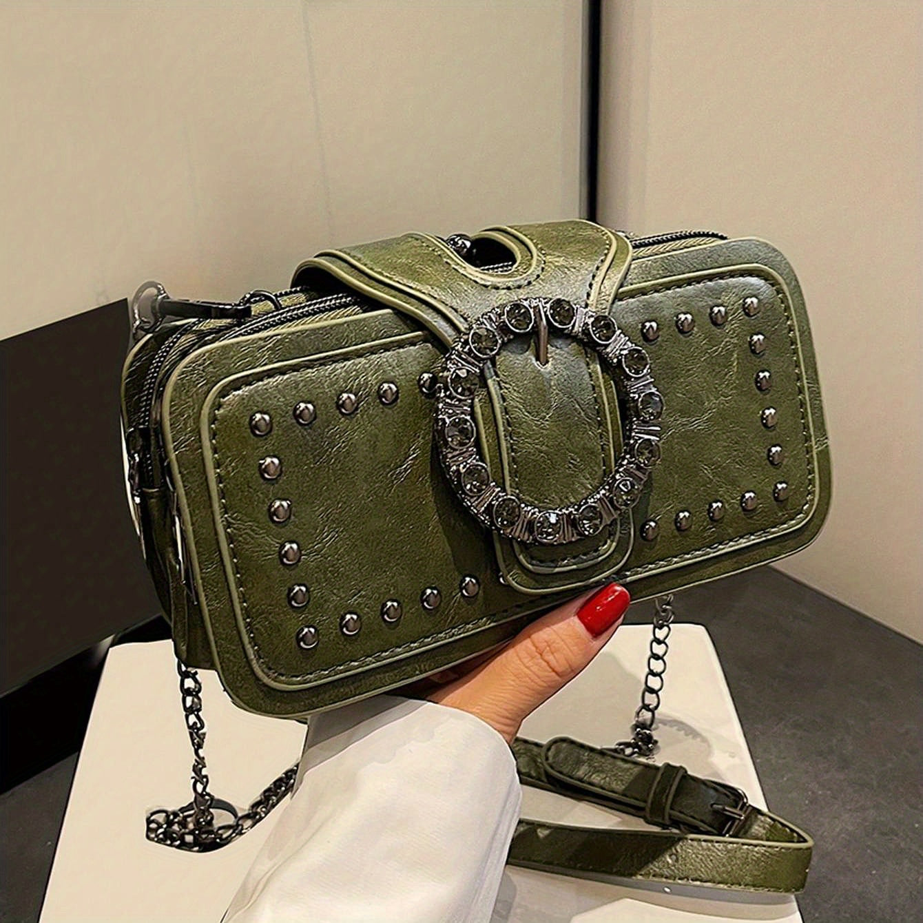 Women's retro clutch bag with rivets, chain shoulder strap, black color, multi-layer clip, and small square design.