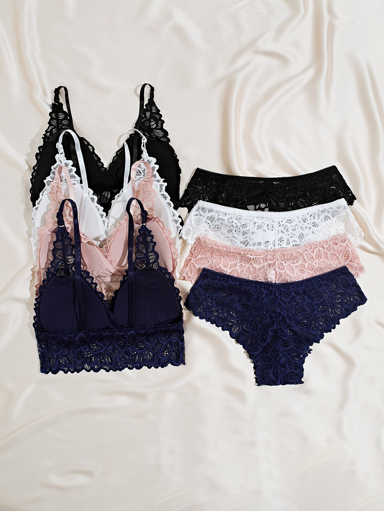 4 sets of women's lace lingerie in black, pink, navy, and white, available in sizes S, M, and L.