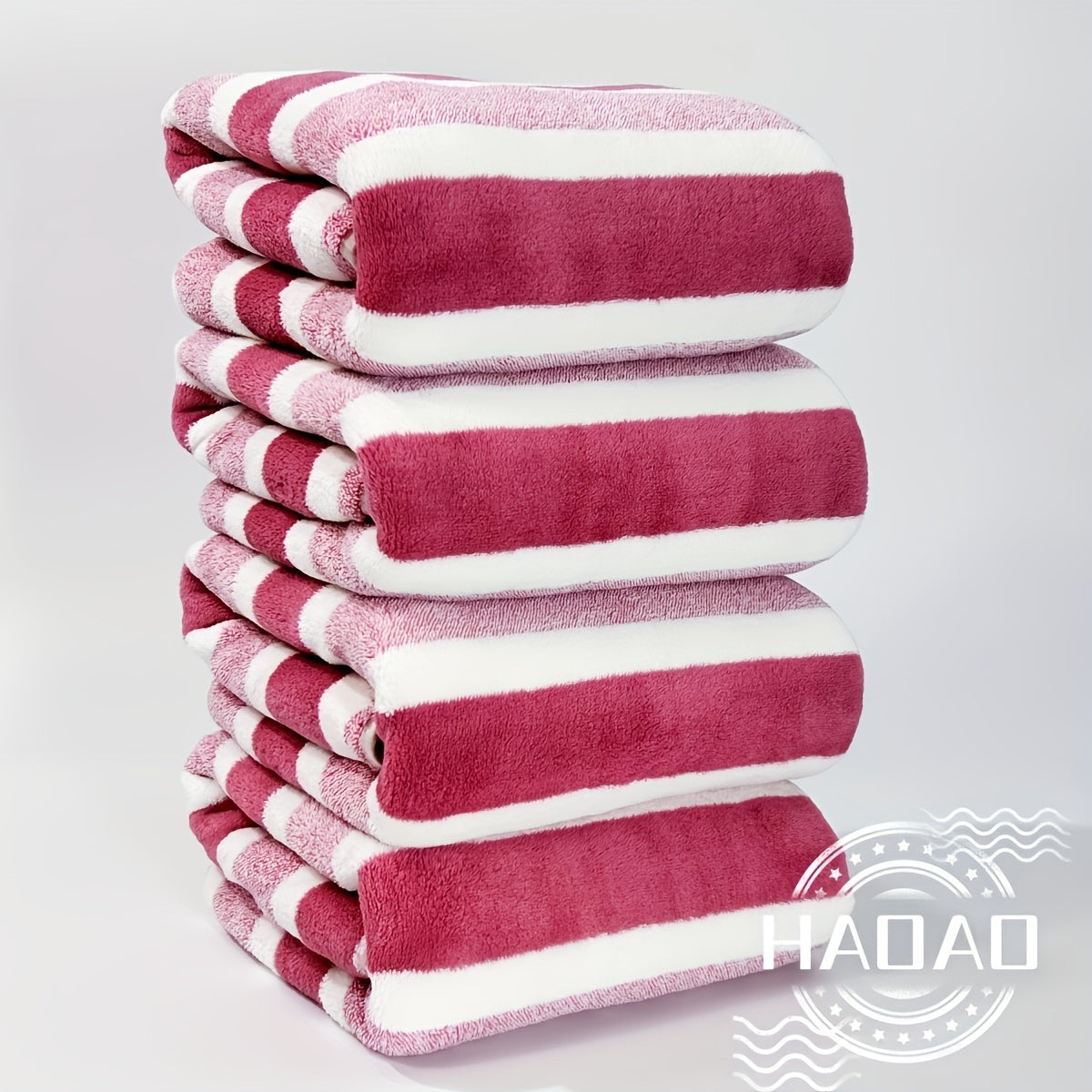 Modern 4-piece coral fleece towel set with geometric pattern, made of 100% polyester for softness and quick-drying absorbency. Ideal space-themed bathroom essential.