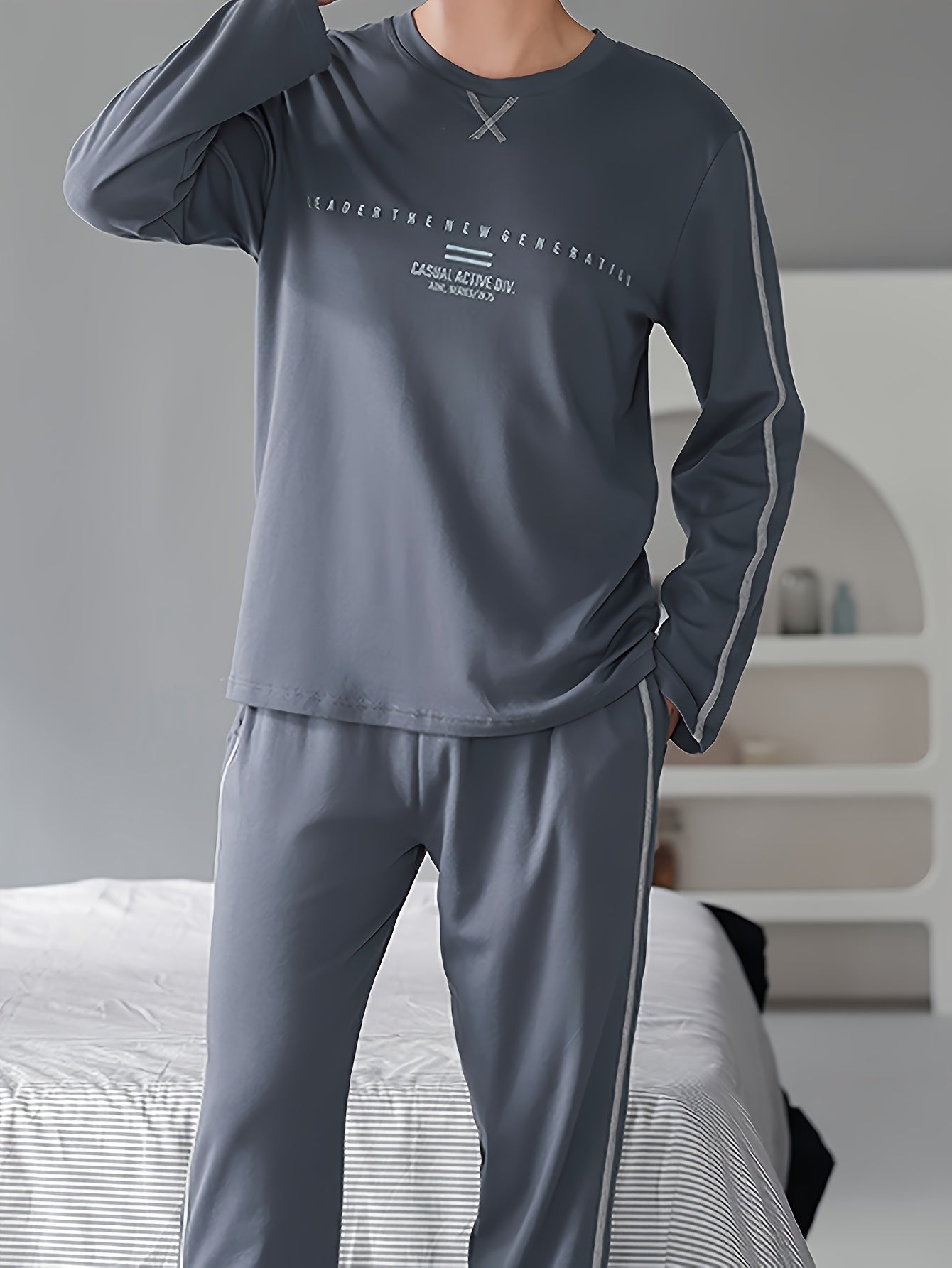 Boys' long-sleeved pajama trousers with monochrome lettering pattern suitable for teenagers.