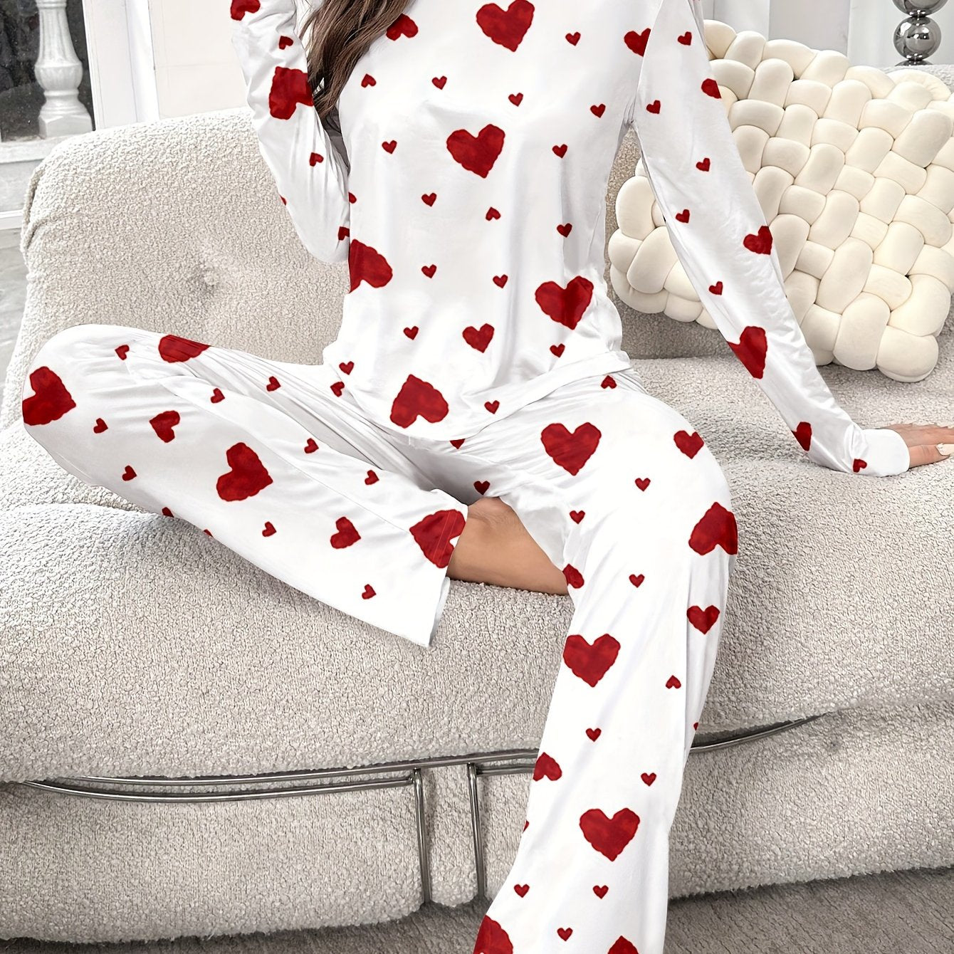 Women's heart print pajama set with round neck and long sleeves. Made from polyester, perfect for cozy home wear in autumn/winter. Includes long pants and pullover.