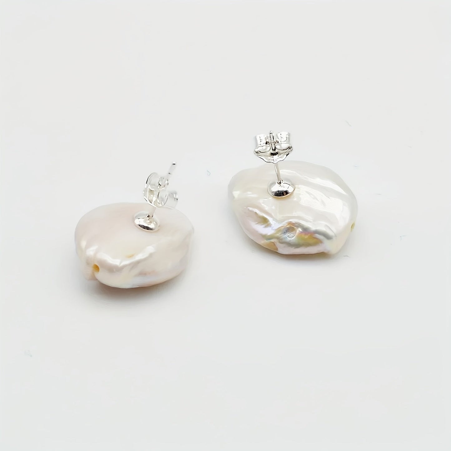 Baroque Pearl Earrings for Women by SAUDADE, featuring Natural Freshwater Pearls set in Silver Plated metal. These earrings boast a simple yet elegant style, making them the perfect gift for both daily wear and Mother's Day. With their timeless design