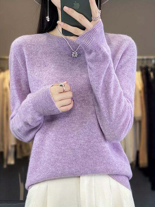 Stylish women's merino wool sweater with cozy crew neck, long sleeves, and solid color knit design for fall/winter.