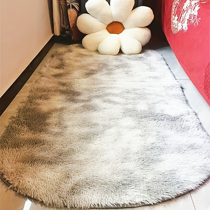 Soft and fluffy oval area rug, designed for use in living rooms, bedrooms, game rooms, and dormitories. Made of non-slip, washable polyester material. Machine-made shaggy rug perfect for adding a cozy touch to your space. Ideal for use as a bedside