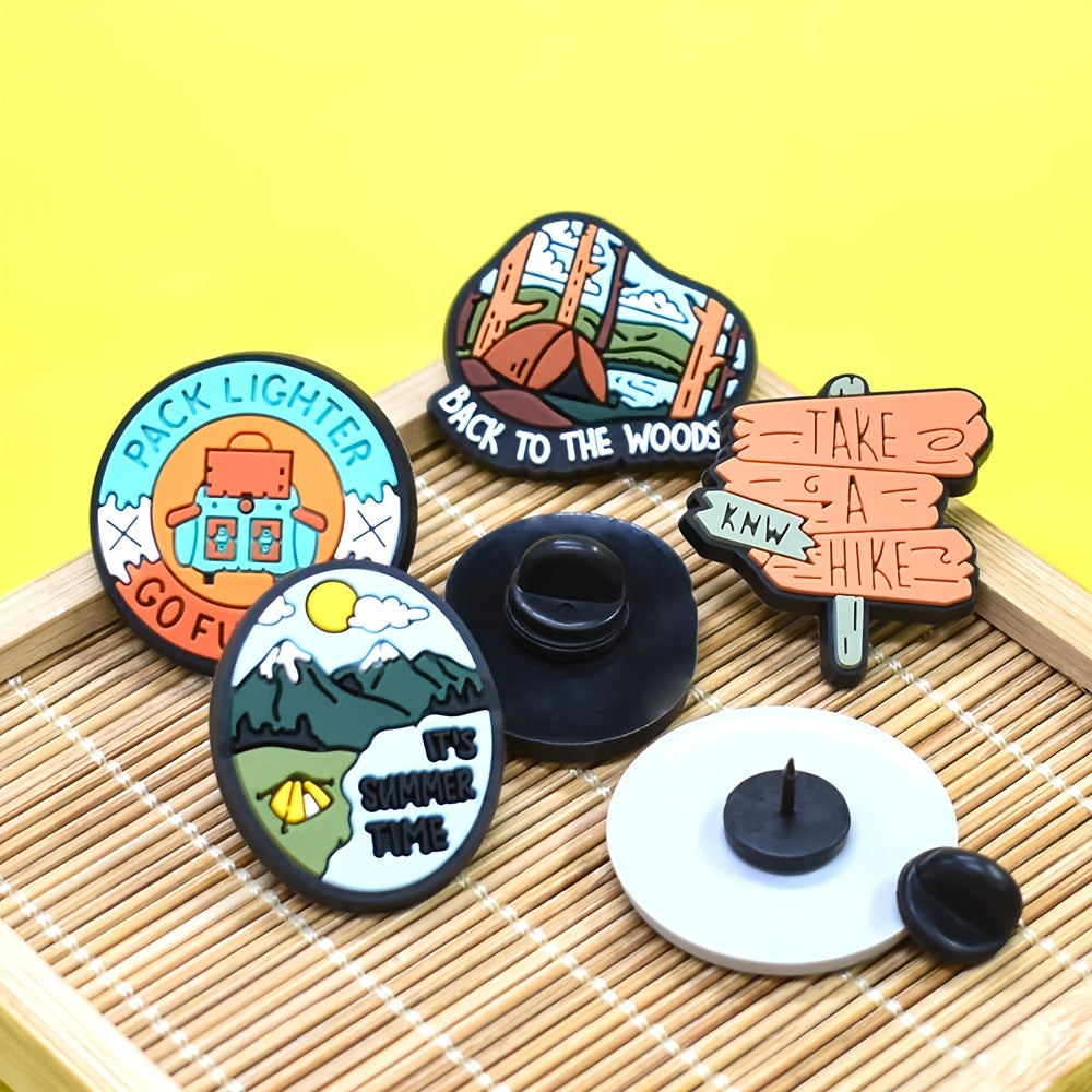 A set of 16 adventure-themed plastic brooch pins featuring travel and nature inspired designs such as trees, rivers, mountains, sun, car, and tent motifs. Perfect for backpack accessories, this holiday gift pin set is sure to inspire any nature lover.