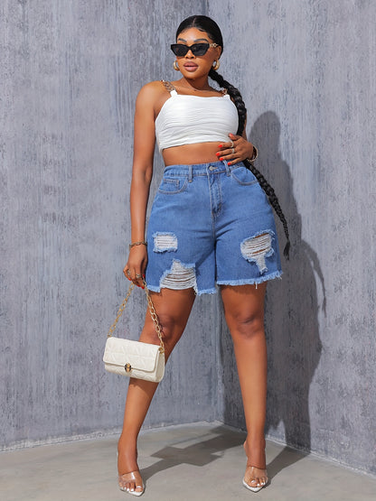 Women's high-waisted denim shorts by Kiki Angel Brand in light blue with ripped details, frayed hem, and slash pockets.