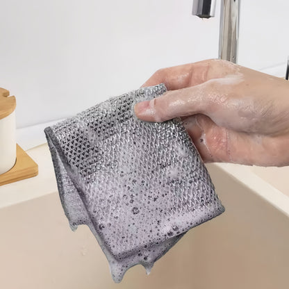 Kitchen scrubbing pads with a double-layer silvery edge are available in packs of 5 or 15. These scratch-resistant cloths can be used wet or dry for cleaning tableware, steel wire, and various surfaces such as bathroom doors and windows. The magic