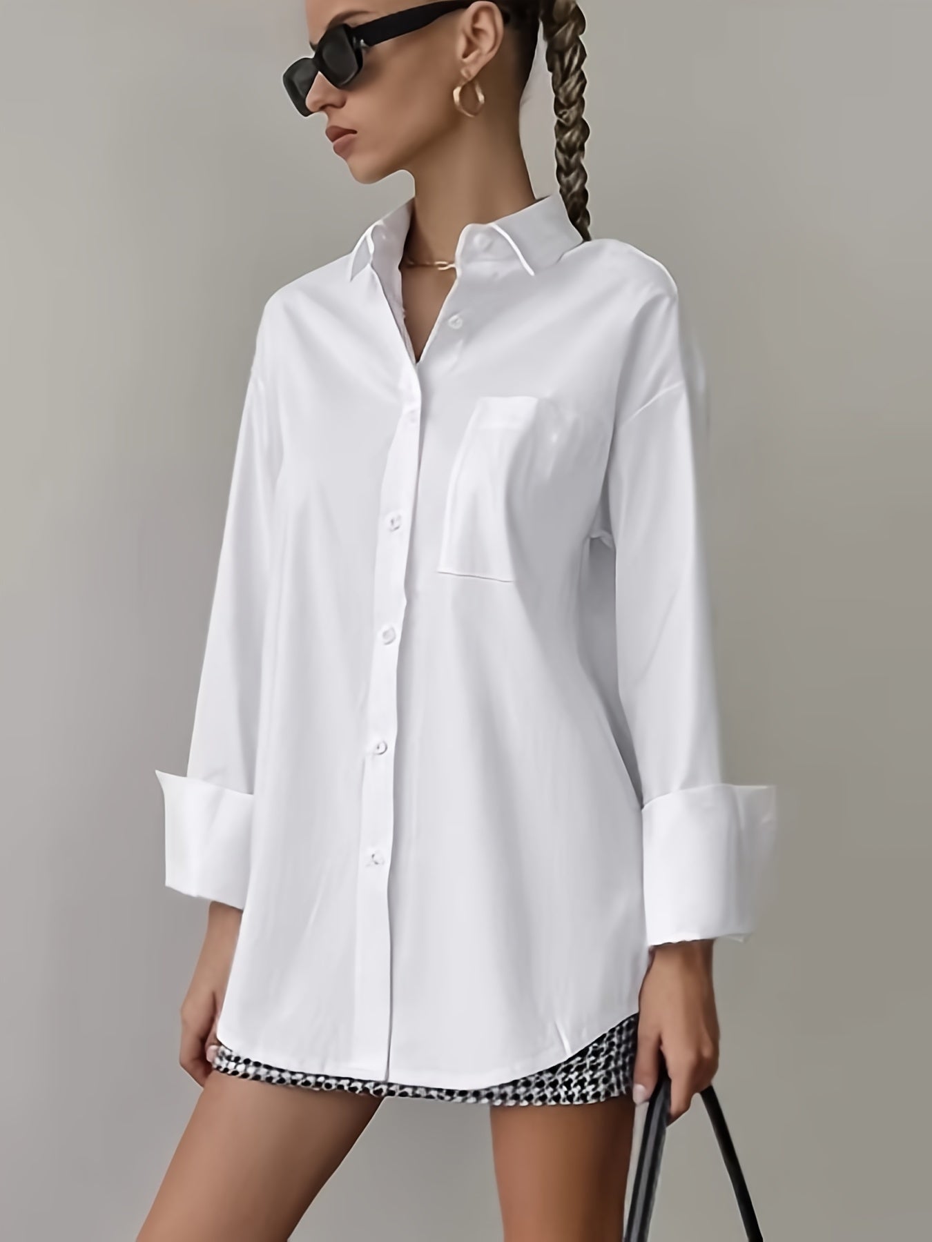 Stylish women's white shirt with pocket, long sleeves, and button-up collar made of non-stretch polyester. Machine washable.